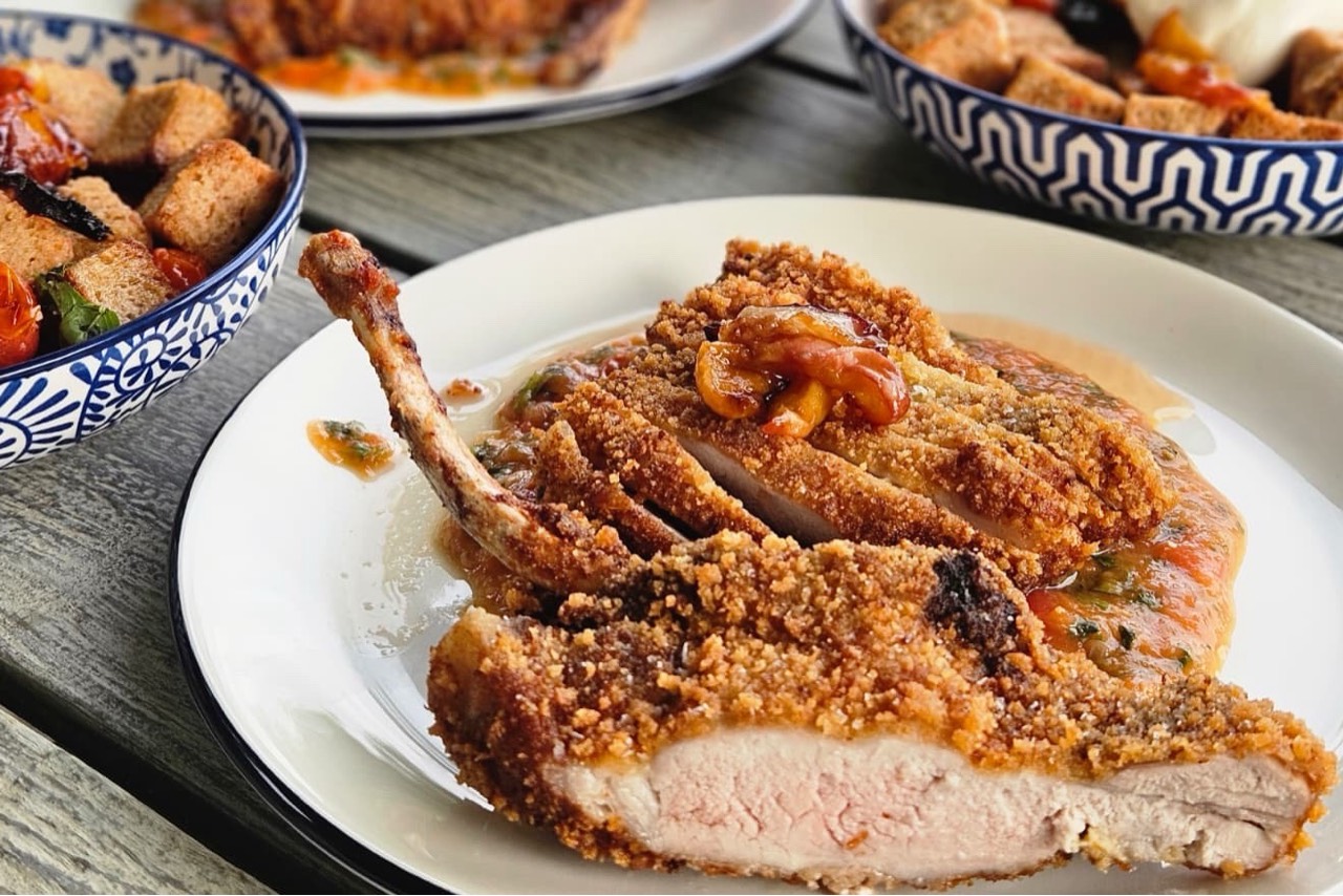 Tomahawk-Style Pork Rib Chop with Peach-Tomato Pan Sauce